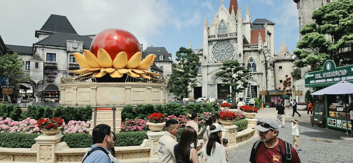 The French village square at Ba Na Hills with a giant lotus sculpture and cathedral