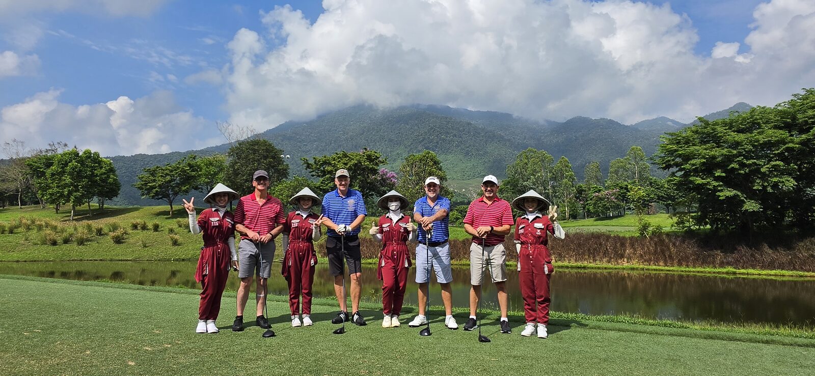 The crew with caddies on the tee at Ba Na Hills