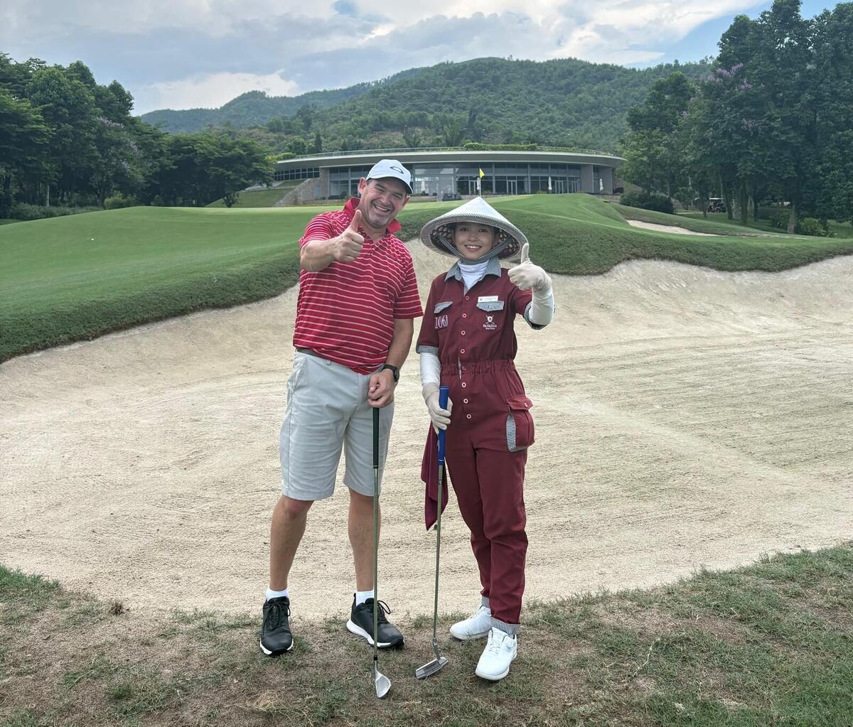 Glenn and his caddie giving a thumbs up in a bunker at Ba Na Hills