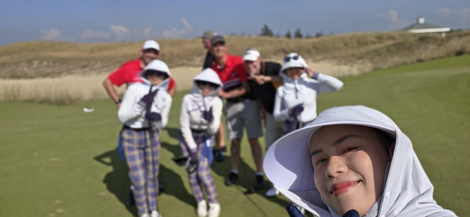 The crew and caddies among the dunes at Hoiana Shores