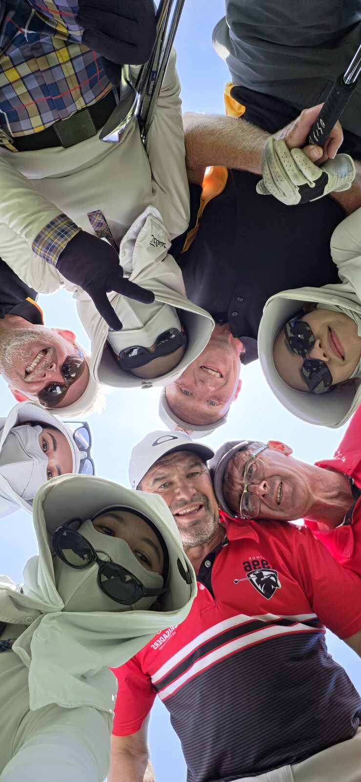 Group huddle selfie with the crew and caddies