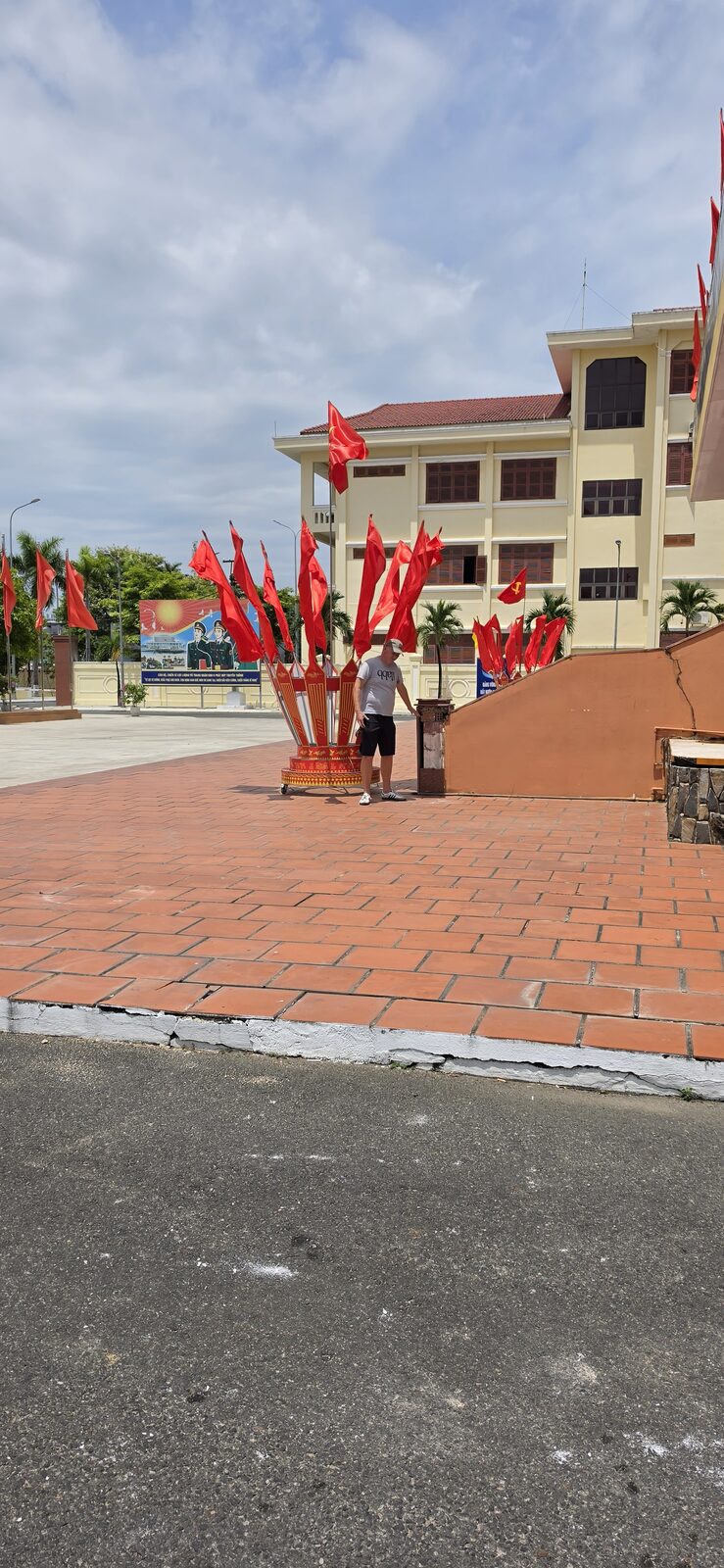 Red flags at a monument in Da Nang