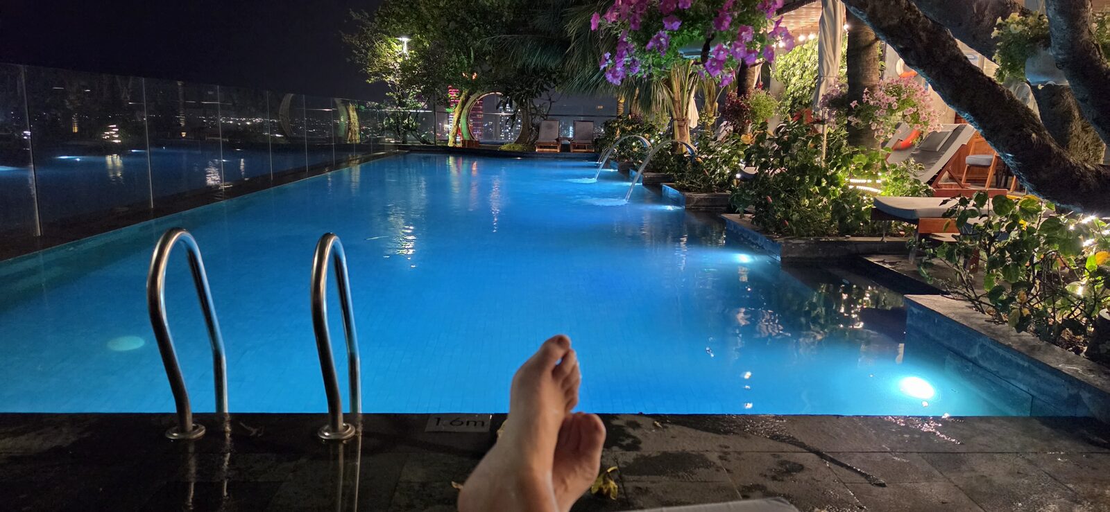 Rooftop infinity pool at the Sala hotel at night
