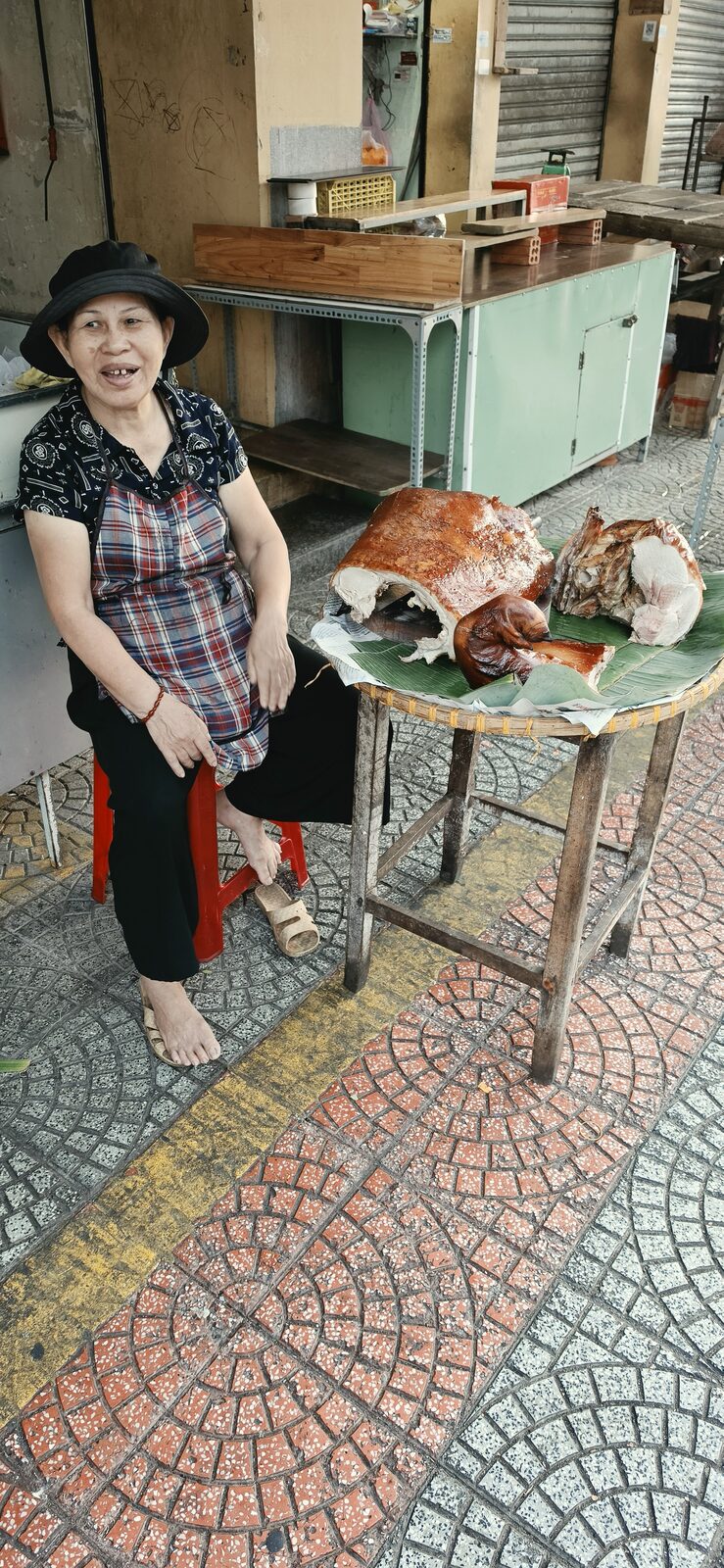 Street food vendor with roast pork