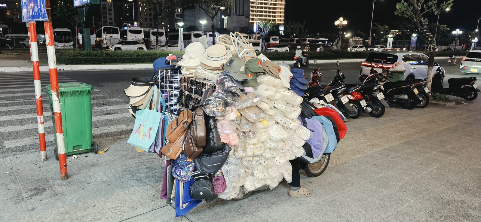 Street vendor cart selling hats and replica goods