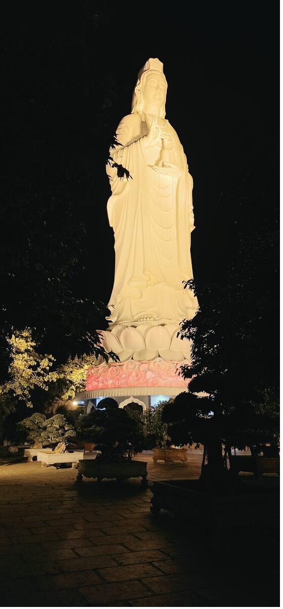 Lady Buddha statue lit up at night at Linh Ung Pagoda, Da Nang